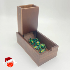 walnut wooden dice tower with green eyeball dice featured on white background