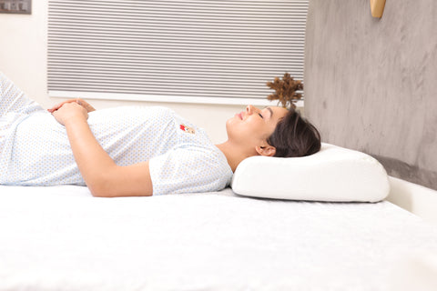 A girl deep sleeping on Contour pillow as spondylitis pillow for her neck relief