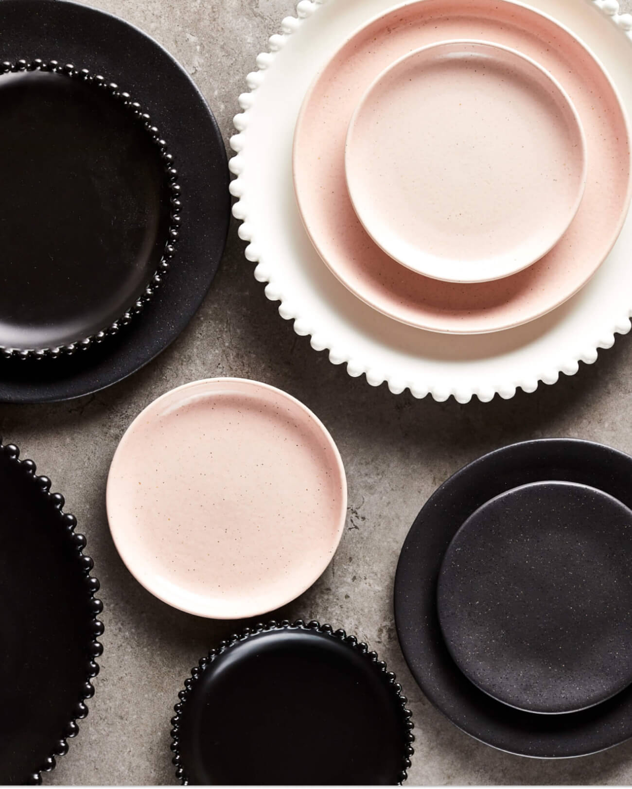 Contrasting crockery and dinnerware in white, pink and black from The Social Kitchen