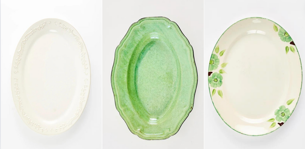 Cream Oval Ceramic Platter With Decoratuve Rim, Cream Platter With Green Flowers on Rim and the Green Oval Platter.