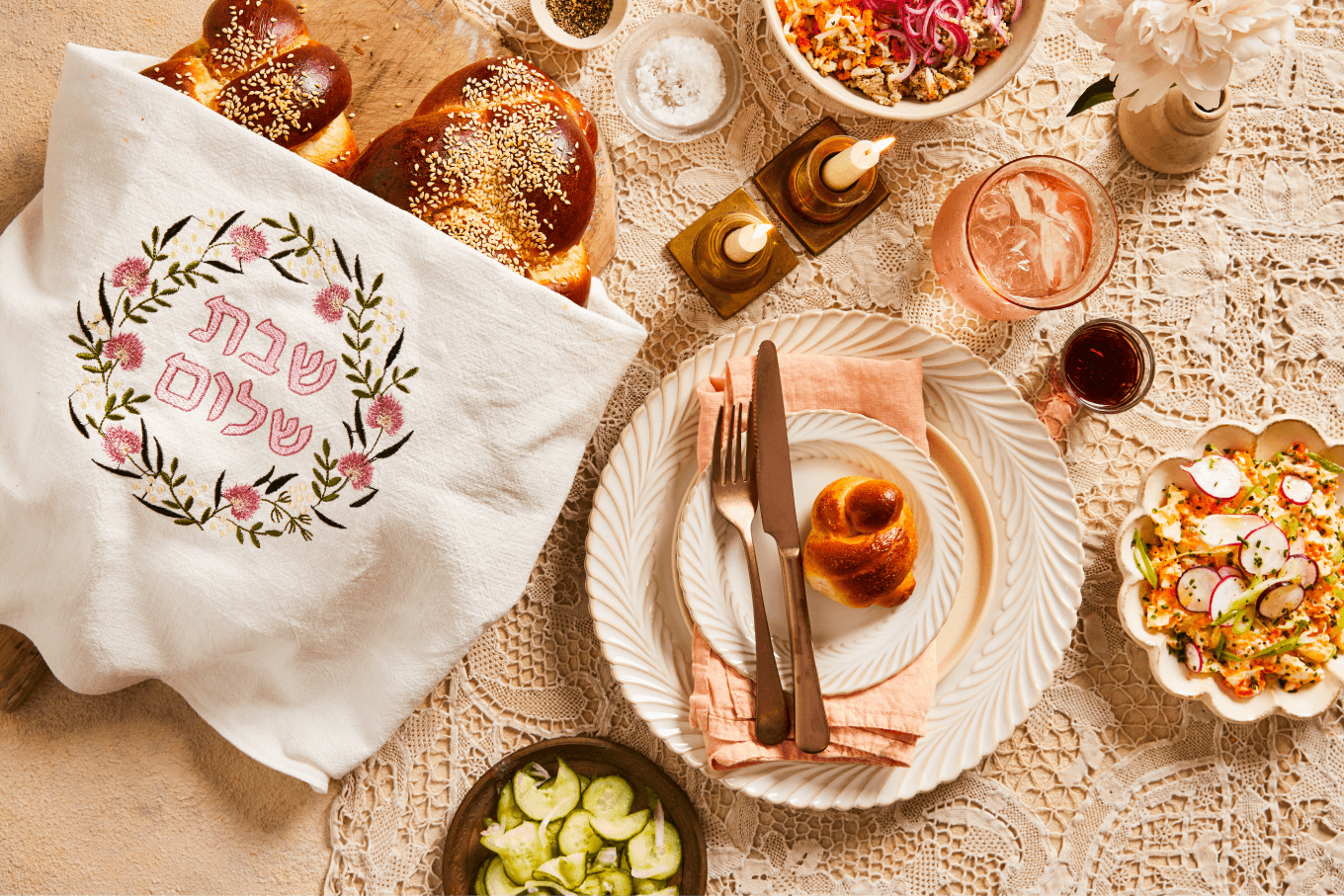 Single Shabbat place setting on a table with crockery and napkins from The Social Kitchen