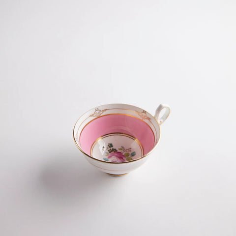 Pink vintage teacup with a floral print inside