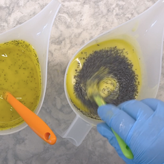 Mixing poppyseeds into the soap batter