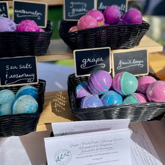 Photo of bath bombs in baskets at a market stand