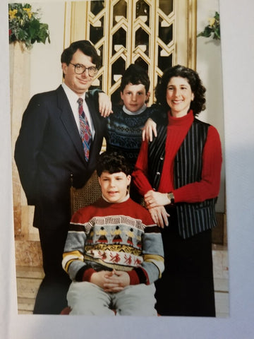 Image: Julie Swartz and her family. Joel is seated in the center.