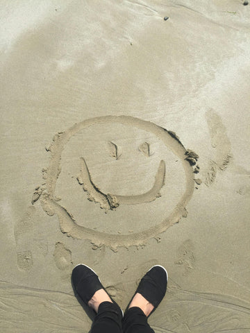 Could mushrooms cure depression? Happy face drawn in sand