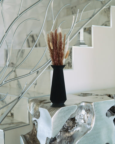 A black vase by Woodland Pulse - an online retailer of modern black vases and modernist vase decor.