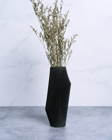 A black vase from the Woodland Pulse modern vase collection. This is wonderful black vase decor to match your contemporary home design.