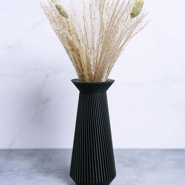 https://cdn.shopify.com/s/files/1/0692/4415/8245/files/Black-Vase-Decor-Unique-Flower-Vases_375x375_crop_center.jpg?v=1689475076