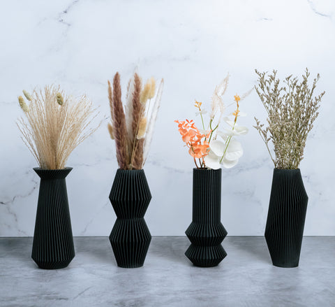 Black vases with modernist vase designs by Woodland Pulse - retailer of modern planters and black vases. These are uniquely woodgrain textured black vase options.
