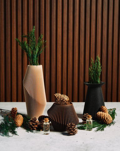 These are three woody textured unique planters by Woodland Pulse that are passive essential oil diffusers infused with cedar oil.