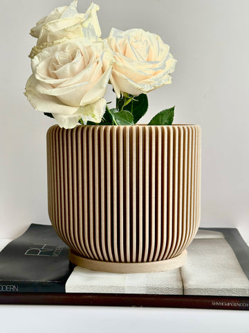 The unique flower pot IONIC by Woodland Pulse. This is a perfect cream pot for counseling office decor.