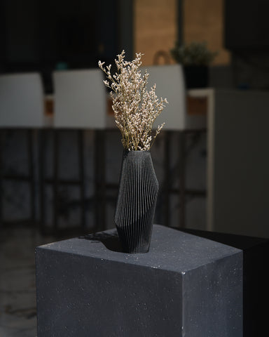 A modern black vase by Woodland Pulse - a seller of modernist vase designs, abstract vase styles, and black vases for pampas grass. 