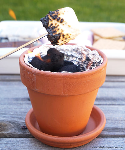Flower pot fire pit with marshmallow smores.