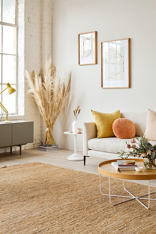 Tall pampas grass decor in glass vase.