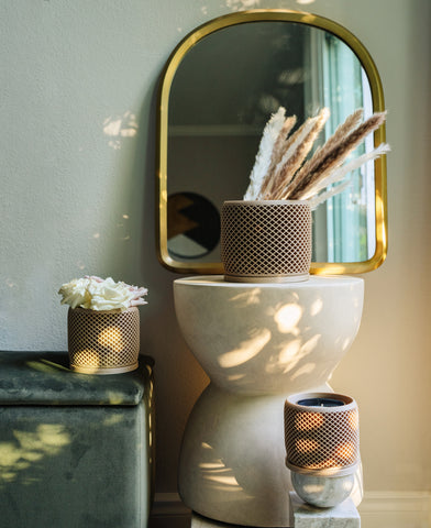 VISION decor plant pots in beige with pampas grass, flowers, and a candle.