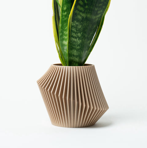 Woodland Pulse | W. Planters showcasing a photo of one of our modern pot planter DISC in beige.