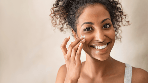 Woman Using Plant Based Cream on Face