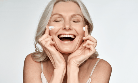 Woman Applying Retinal Cream