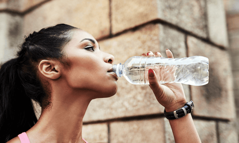 Woman Drinking Water to Tighten Skin