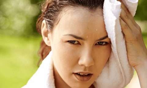 Woman Wiping Sweat Off Face