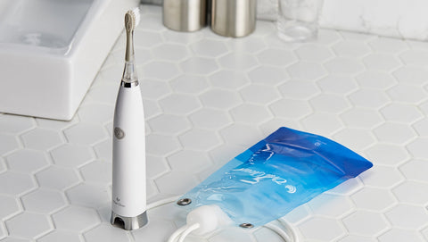 bluereo electric suction toothbrussh G100 on the bathroom tile.