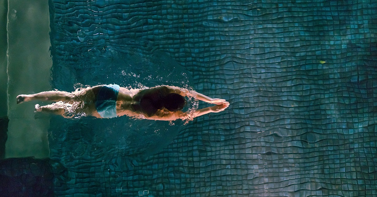 A swimmer in an indoor pool.