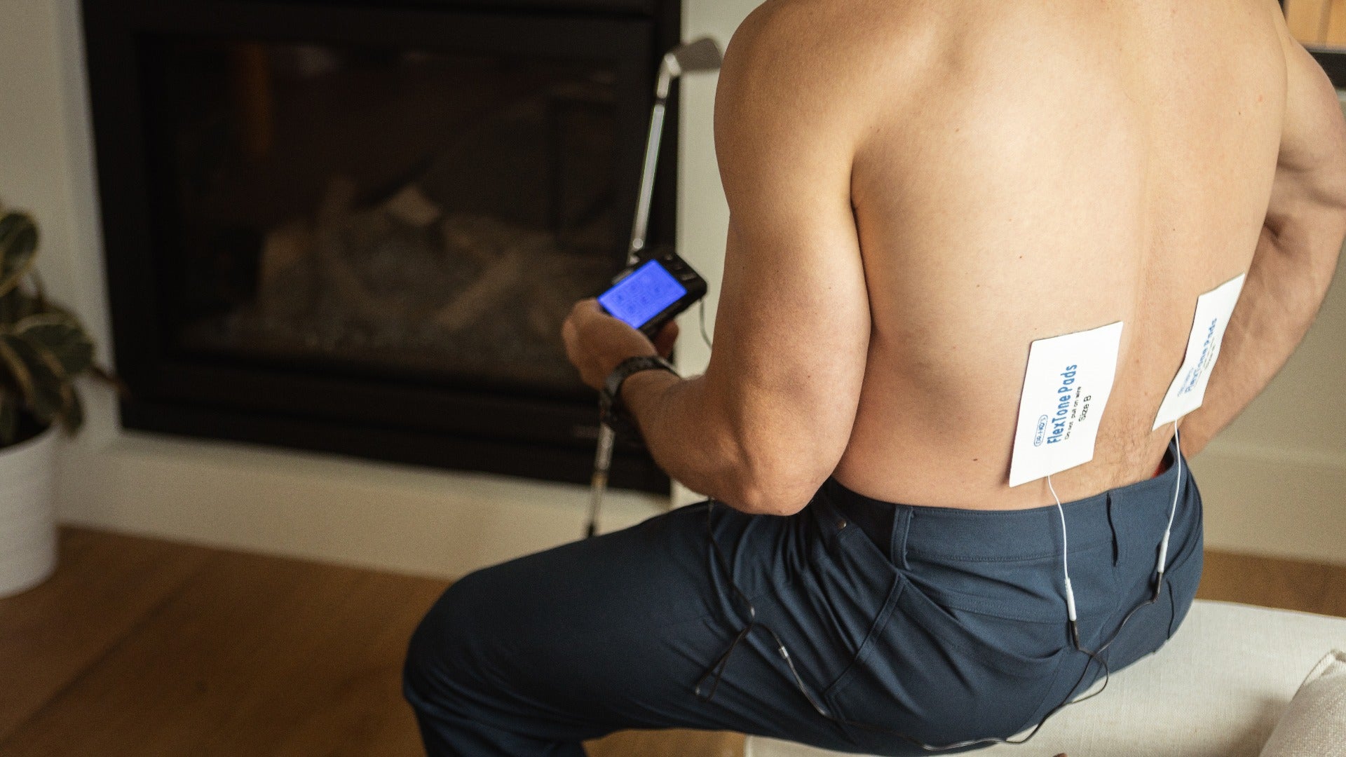 man wearing dr-hos tens gel pads on lower back