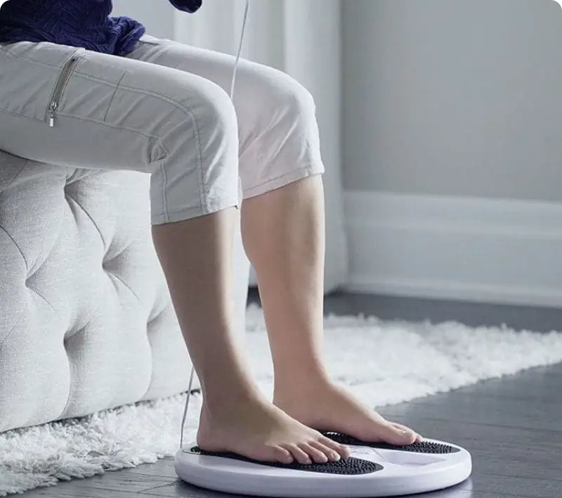 Person using a foot massager at home.