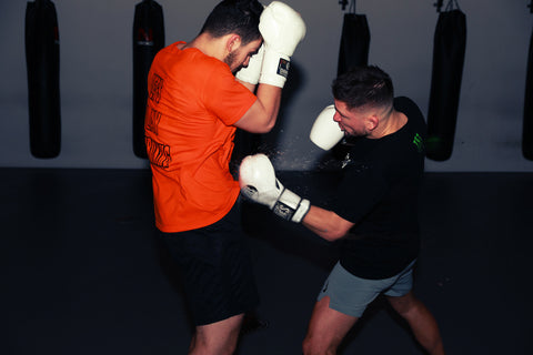 A photo of Andy Souwer demonstrating his Dutch Kickboxing System for training fighters