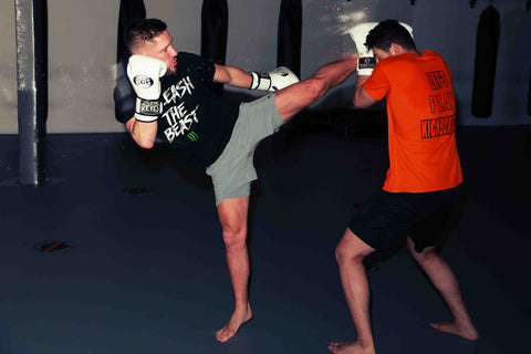 A photo of Andy Souwer demonstrating his Dutch Kickboxing System for training fighters