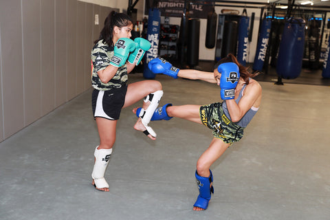 A photo of two fighters using striking drills for raising fight IQ whilst training