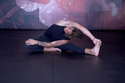 A photo of Cameron Walker-Shepherd demonstrating flexibility for high kicks with yoga for martial arts stretching and mobility
