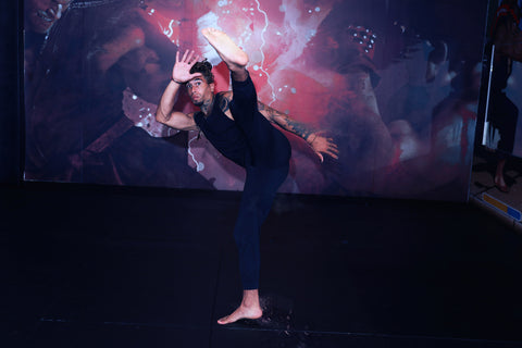 A photo of Cameron Walker-Shepherd demonstrating flexibility for high kicks with yoga for martial arts stretching and mobility