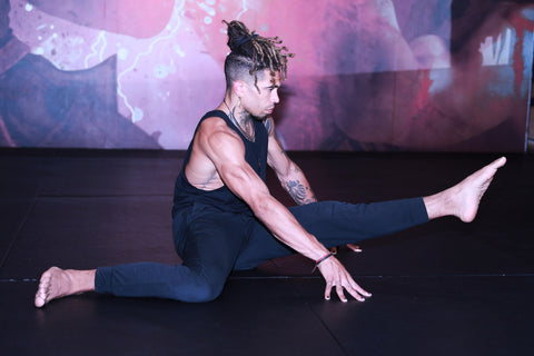 A photo of Cameron Walker-Shepherd demonstrating flexibility for high kicks with yoga for martial arts stretching and mobility