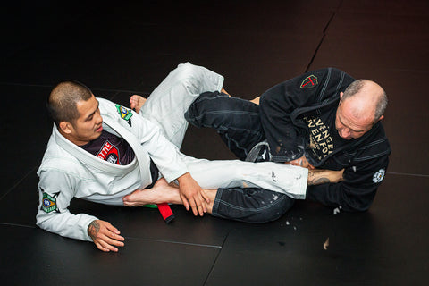 A photo of leg locks in action from the Combat Base Darren and Helen Currie BJJ volume Simplifying Leg Locks