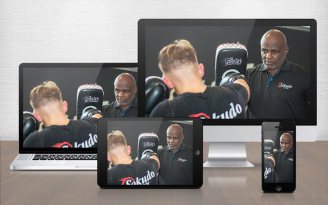 A graphic image of Ernesto Hoost training world level dutch kickboxing with one of his fighters