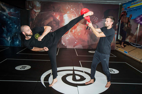 A photo of Damon Sansum and Martin Stamper from their Taekwondo Spinning Kicks for Elite Combat Sports Volume