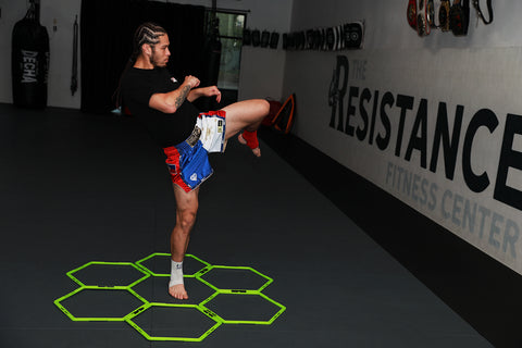 A photo of Eddie Abasolo shadow boxing using the rhythm of muay thai solo training system