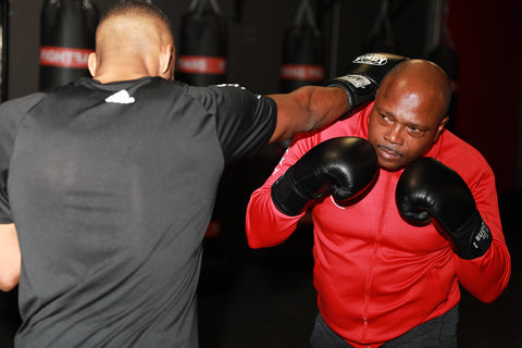 A photo of Ivan Hippolyte using the Vos Gym Kickboxing System in Training