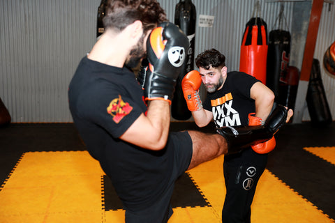 A photo of Jay Jauncey demonstrating how to fight taller opponents in Kickboxing Training