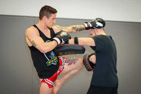 A photo of a fighter demonstrating southpaw to orthodox elite level striking with Kieran Keddle