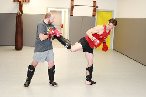 A photo of Kieran Keddle demonstrating how to train Muay Thai when developing elite fighters