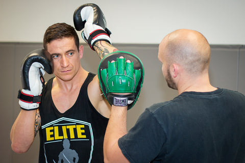 A photo of a fighter demonstrating southpaw to orthodox elite level striking with Kieran Keddle