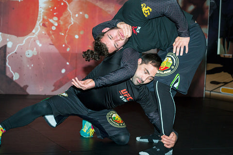 A photo of Lyubo Kumbarov demonstrating advanced wrestling for BJJ & MMA