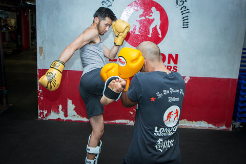 A photo of two people sparring from the blog post Hard Sparring in Muay Thai, Kickboxing and MMA