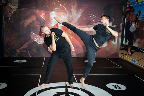 A photo of Damon Sansum and Martin Stamper from their Taekwondo Spinning Kicks for Elite Combat Sports Volume
