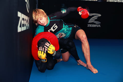 A photo of Paddy Pimblett demonstrating techniques from the High Percentage MMA - Next Generation MMA Fighting System with Paul Rimmer and Ellis Hampson