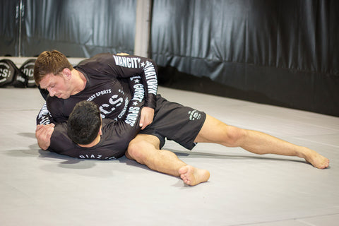 A photo of Stuart Cooper as he showcases his BJJ Pressure Passing System whilst Killing Guard