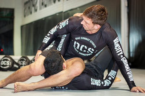 A photo of Stuart Cooper as he showcases his BJJ Pressure Passing System whilst Killing Guard